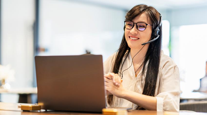Businesswoman talking to the camera video calling